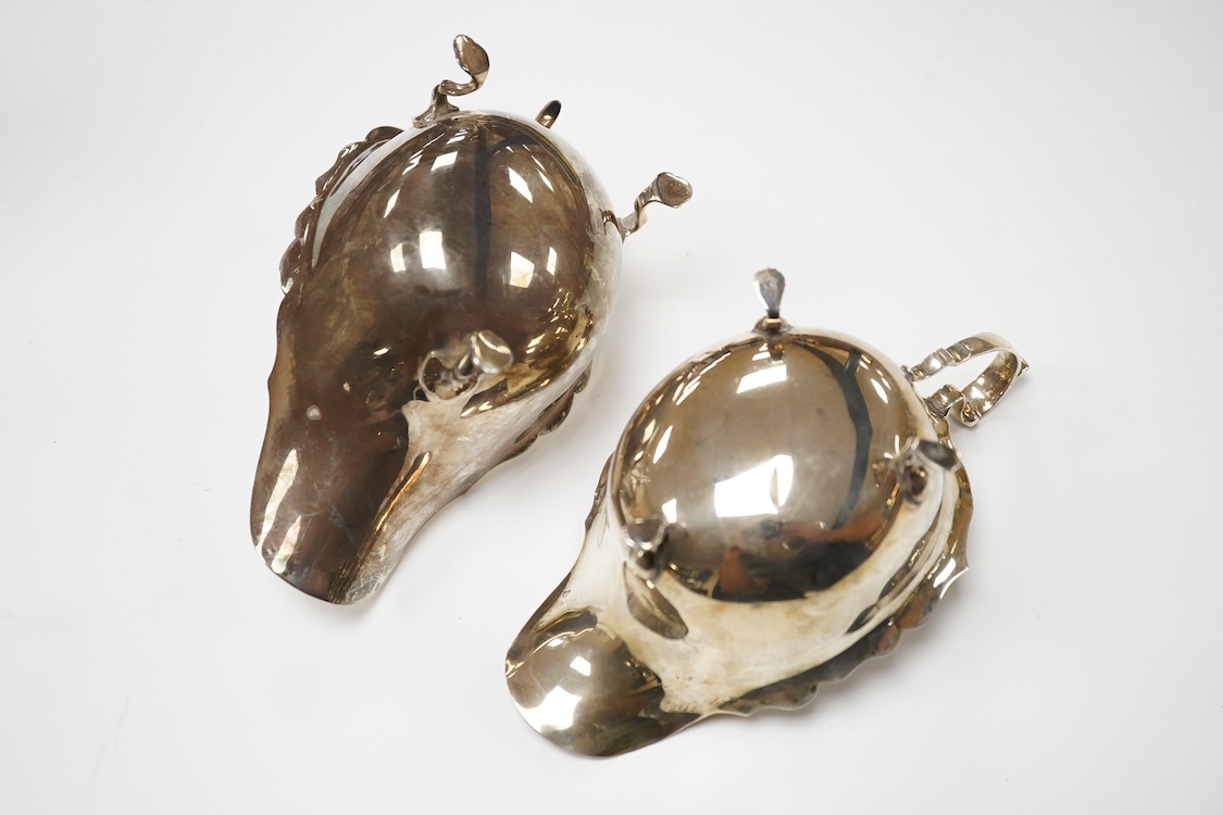 Two George V silver sauceboats, William Hutton & Sons, Birmingham, 1910 and S. Blanckensee & Sons, Birmingham, 1916, both approx. 16cm in length, 7.1oz.